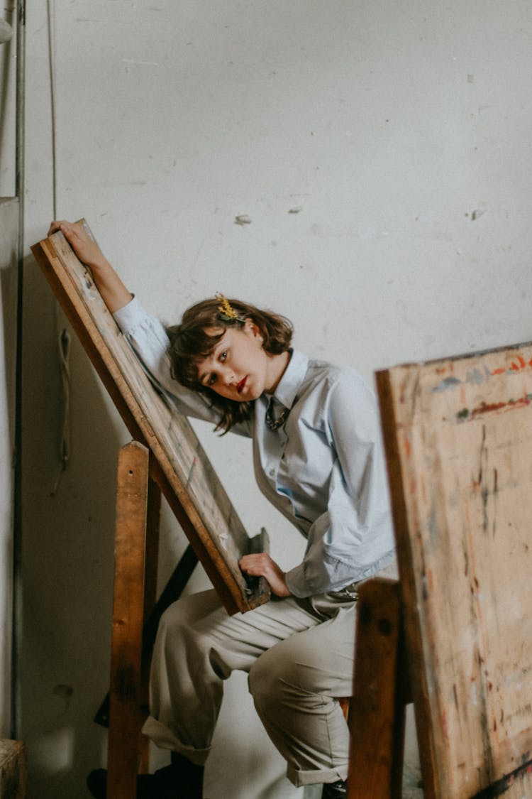 Photo Of Woman Leaning On A Painting Easel