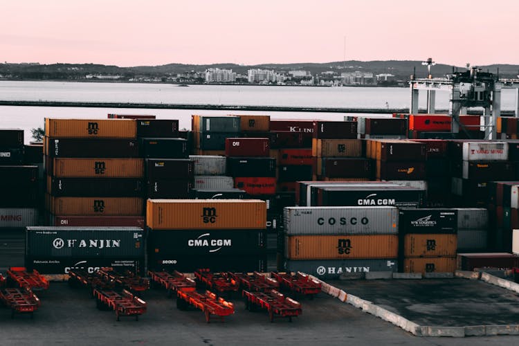 Assorted-color Cargo Containers Near Body Of Water