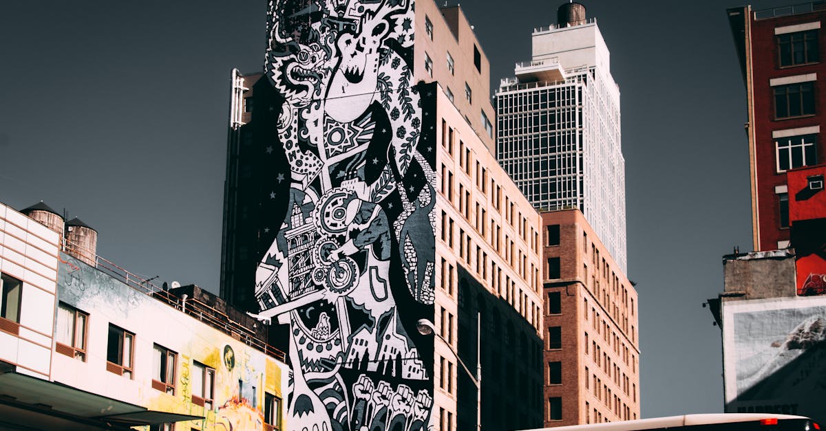 A striking mural on a city building in downtown New York City, showcasing urban art and architecture.
