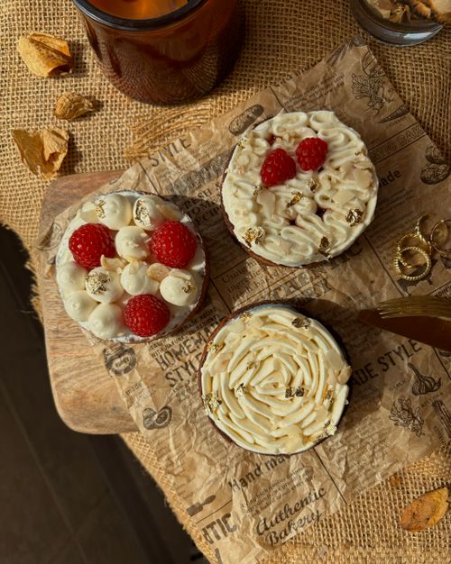 Free Delicious homemade cakes with raspberries on rustic surfaces, perfect for food photography. Stock Photo