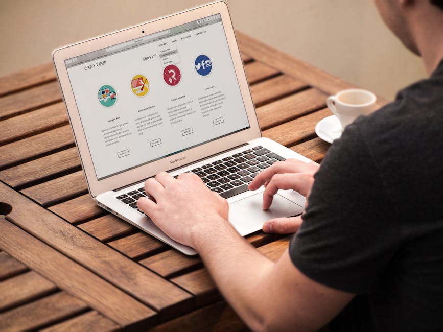 Person Typing on Macbook Air