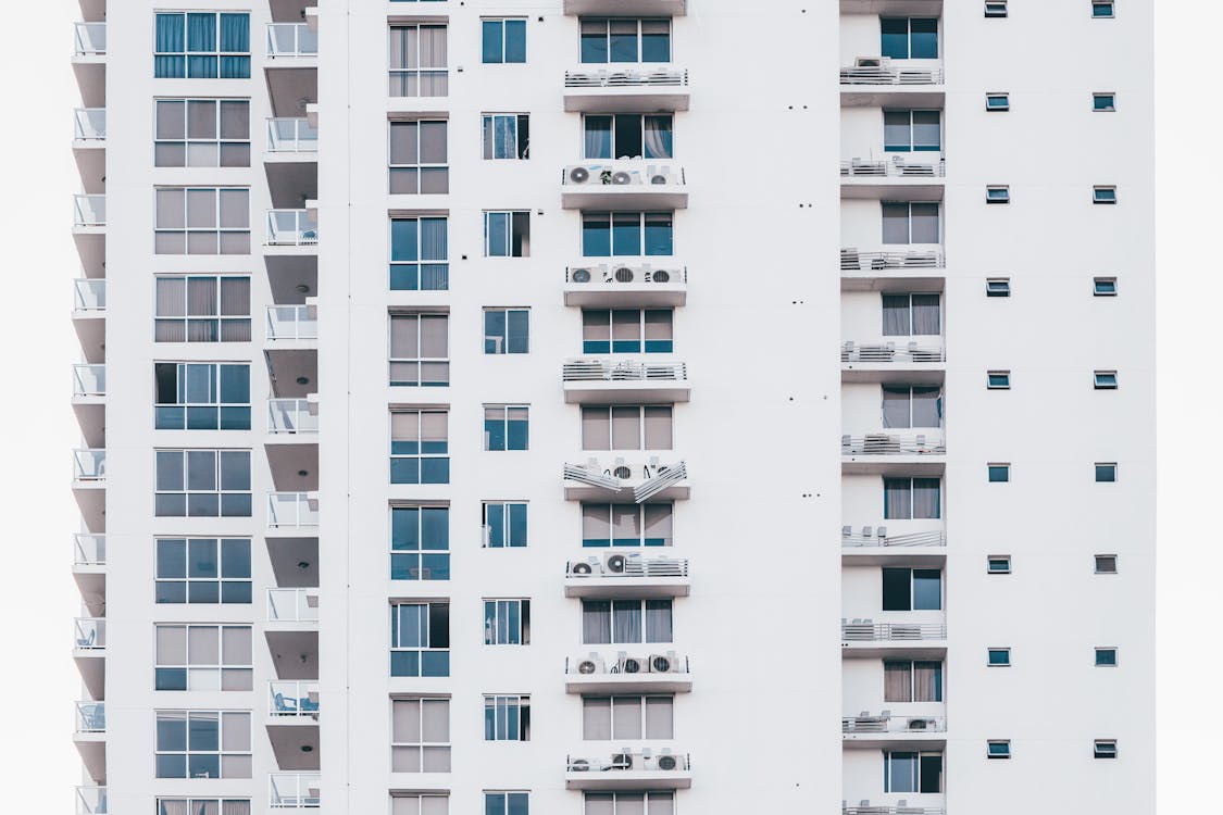 Minimalist Photography of White and Gray Condominium