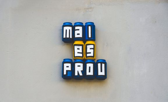 Creative wall art featuring cans spelling out words in bold colors.