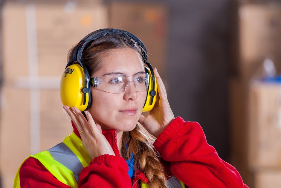 Woman Wearing Yellow Ear Pads and Goggles