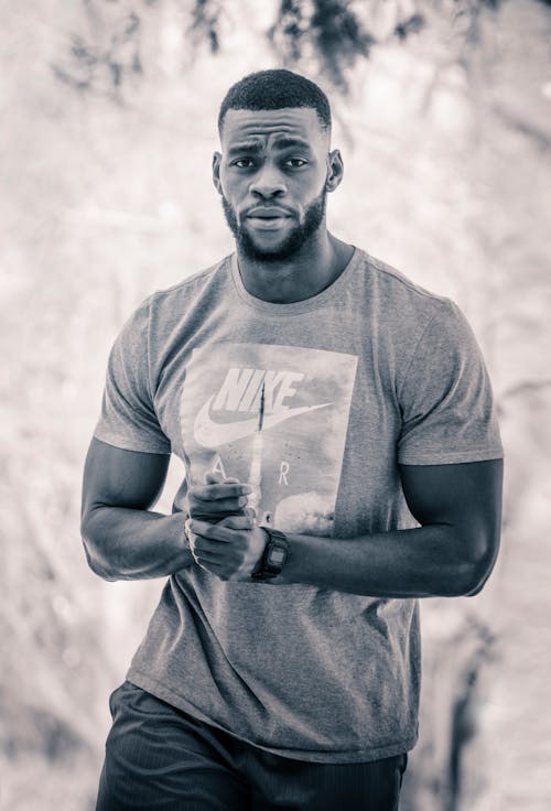 Free Grayscale Photo Of Man In Nike Crew Neck T-shirt Stock Photo