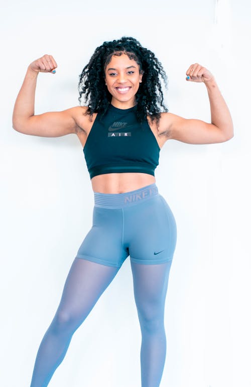 Free Woman Flexing Her Biceps Stock Photo