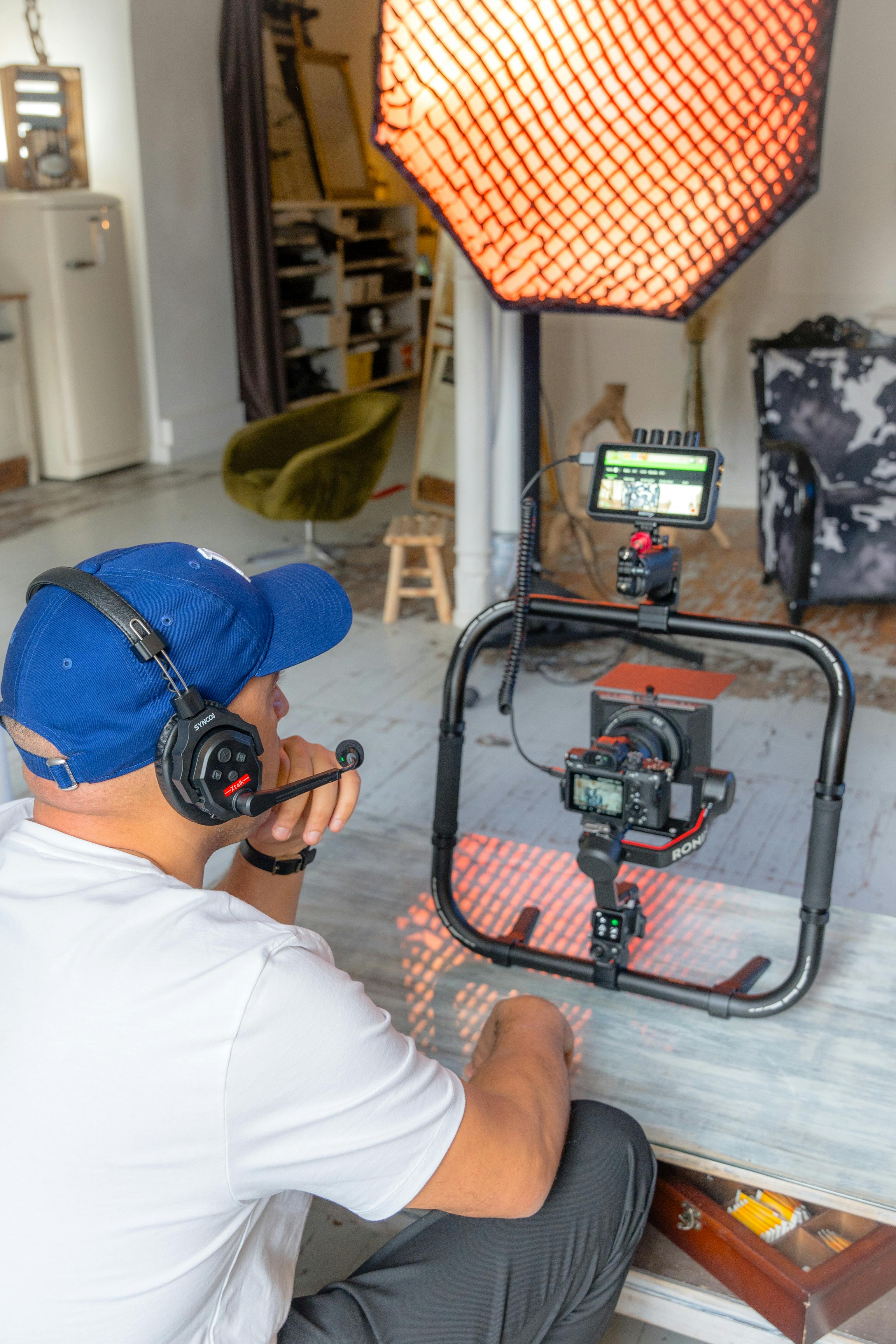 man sitting on the floor with the photographic equipment