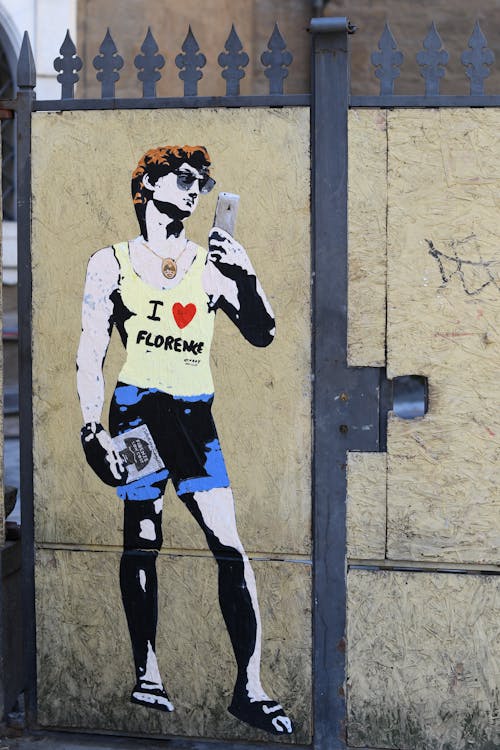 A graffiti of a man in shorts and a tank top