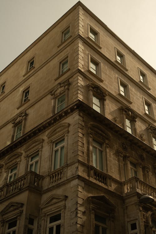 A tall building with windows and balconies