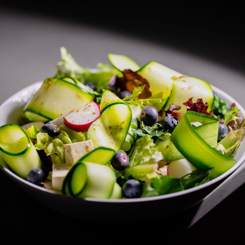 Charred Zucchini and Herb Feta Couscous Salad with Pine Nuts