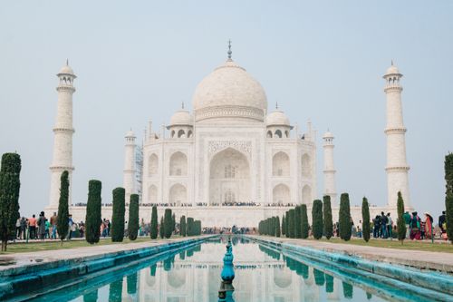 Free Spectacular view of the Taj Mahal with a clear reflection in the foreground pool, a UNESCO World Heritage Site. Stock Photo