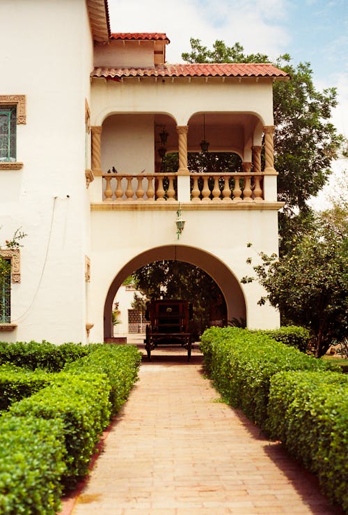 A house with a walkway and a garden