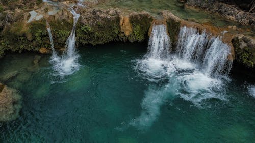 Kostnadsfri bild av naturlig stenbildning, över vatten, vattenfall