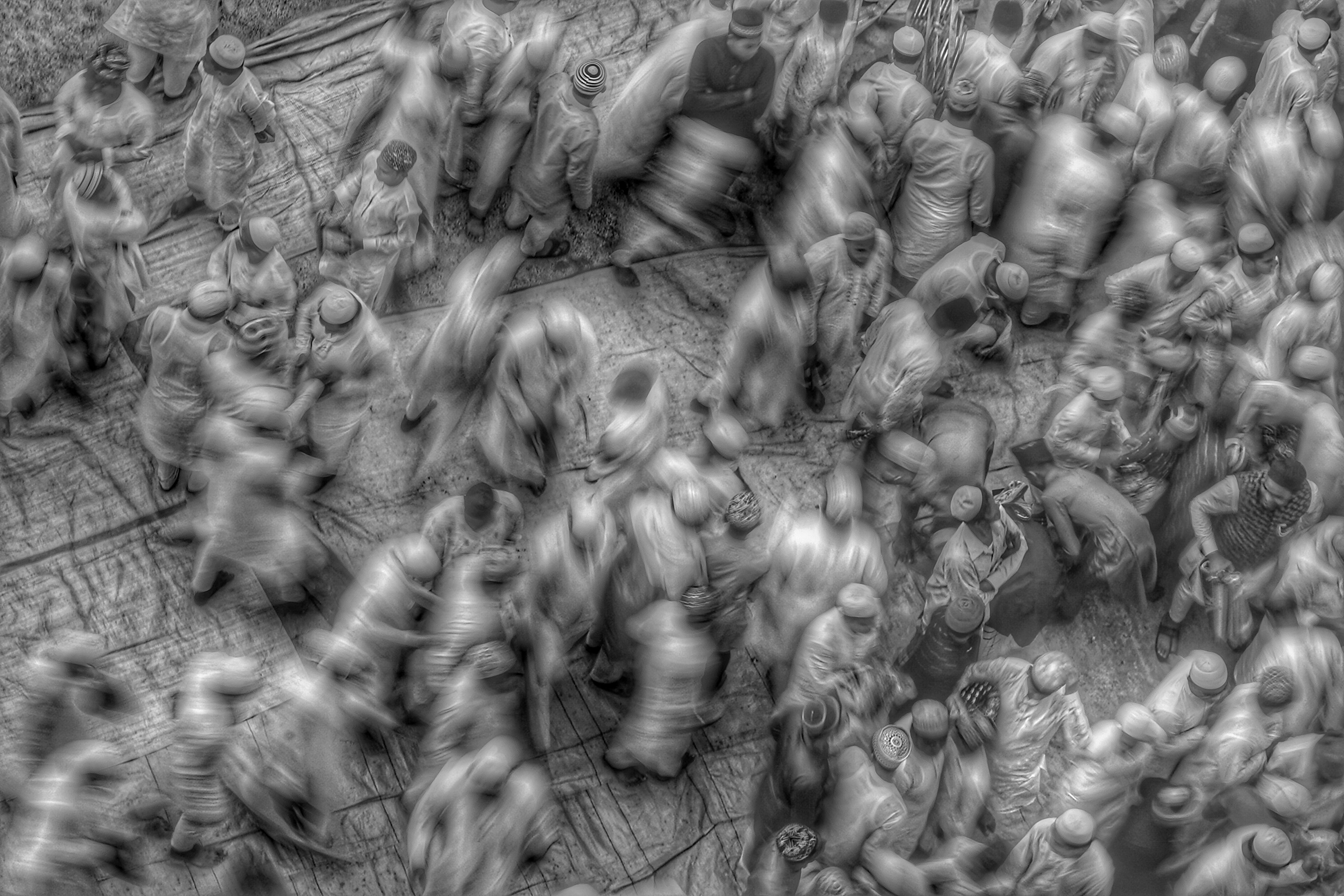 Captivating blurred motion capture of a bustling crowd viewed from above in Howrah, India.