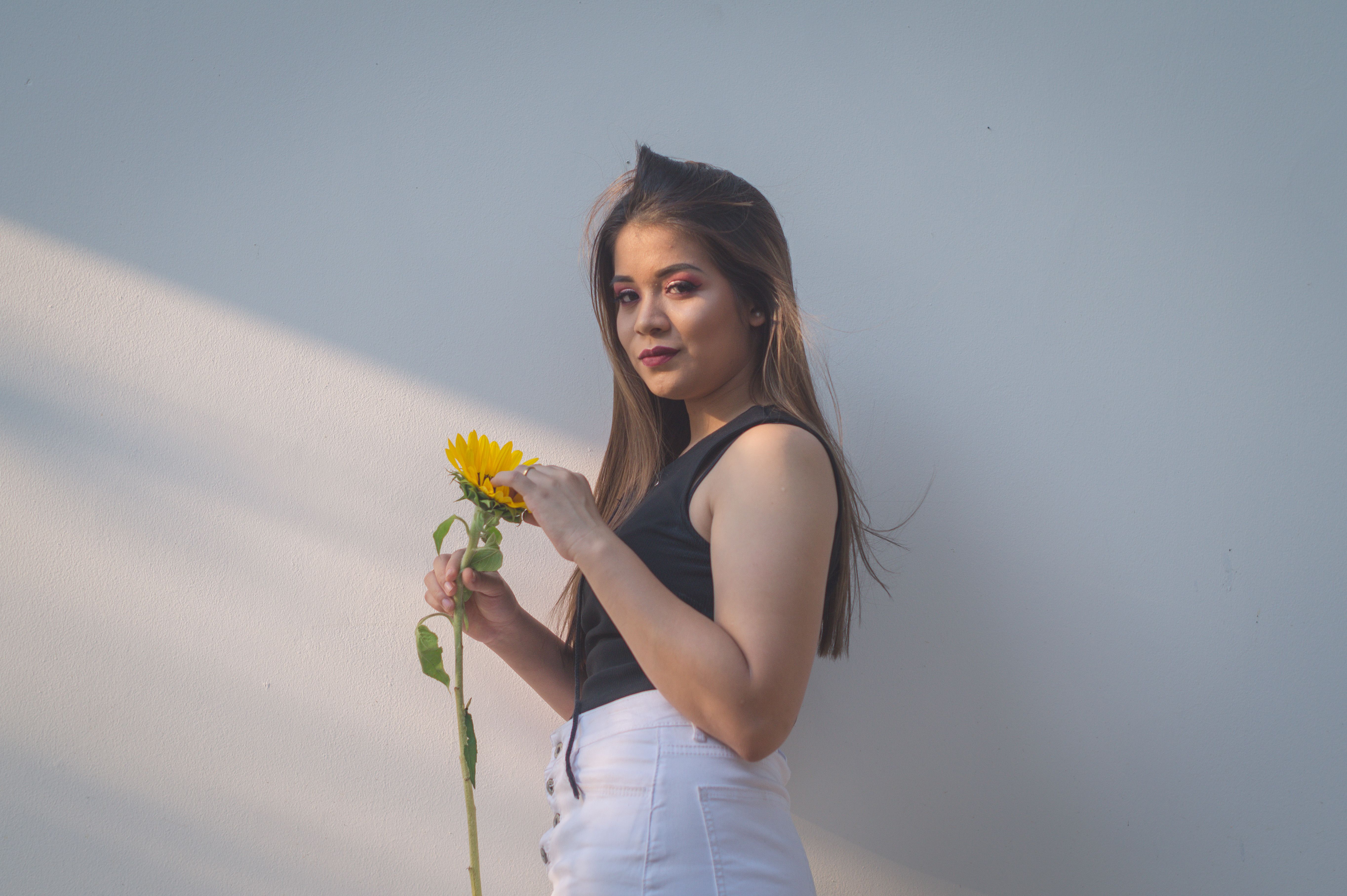 Woman Holding Yellow Sunflower · Free Stock Photo