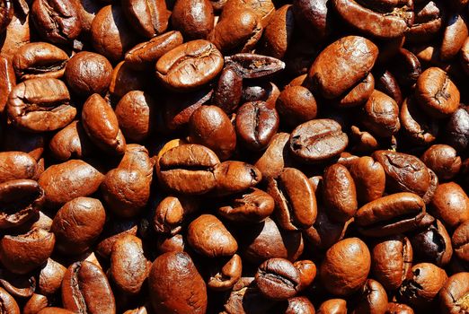 Detailed macro shot of roasted coffee beans highlighting texture and color.