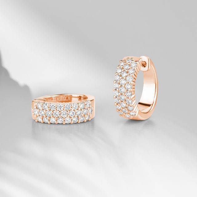 Gold stud earrings set with diamonds