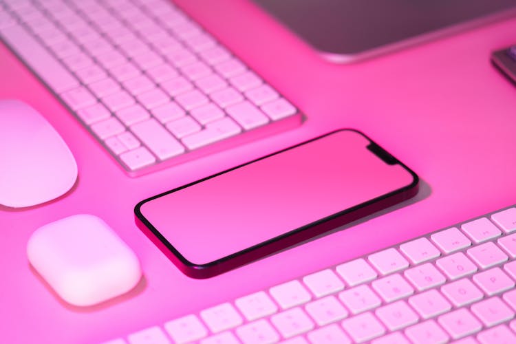 Electronic Office Devices. Blank Green Mockup. Pink Background.