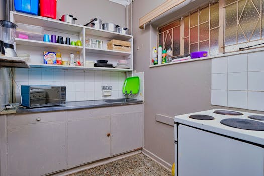 Modern kitchen interior with appliances and open shelving in Pretoria home.