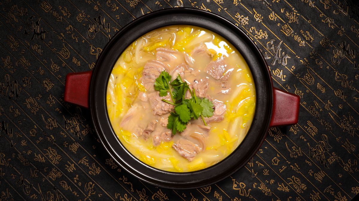 A rich stew simmering in a pot, similar to traditional African stews built from key pantry ingredients