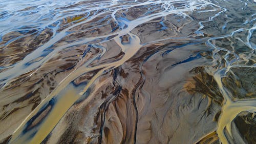 An aerial view of the water and sand