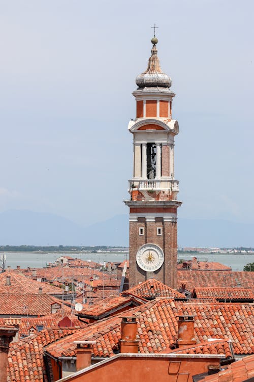 Tower of Parish Church of the Holy Apostles in Venice over Rooftops of Buildings