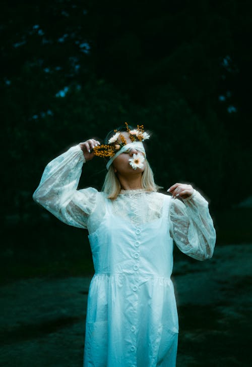 Blonde Woman with Flowers under Blindfold