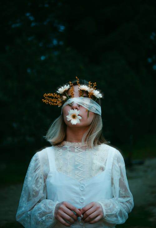 A woman with flowers in her hair and a veil