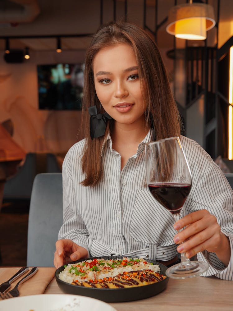 Woman Eating A Meal At A Restaurant