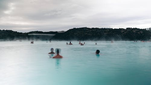 People swimming in the blue lagoon in iceland