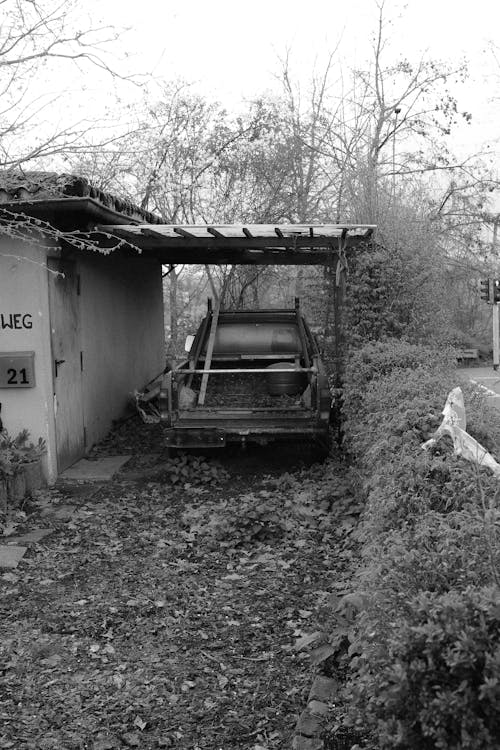 A black and white photo of a car in a garage