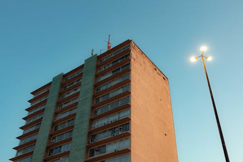 A tall building with a street light in front of it