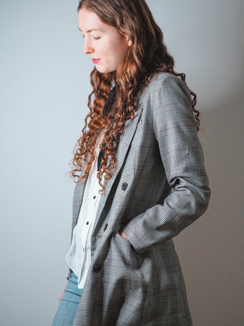 A woman in a plaid jacket and jeans