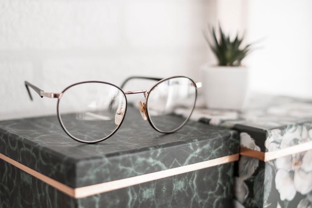 Eyeglasses resting on a surface