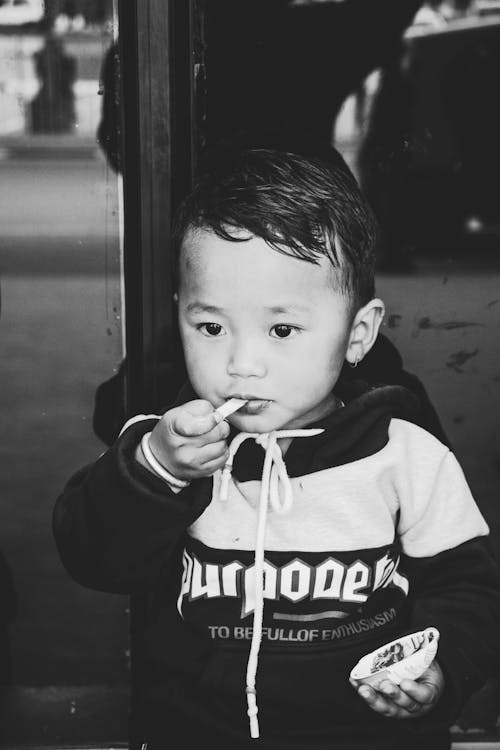 Monochrome Photo of Baby Wearing Jacket