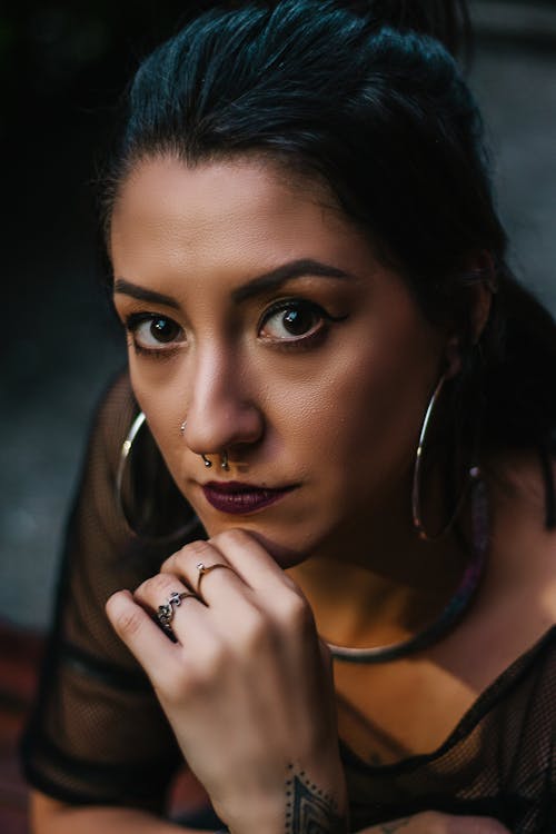 Close-up Photo of Woman Holding Her Chin