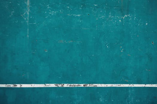 绿松石混凝土表面带有白线纹理的抽象视图，是理想的背景