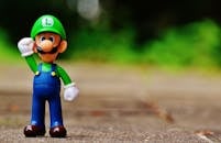 Shallow Focus Photography of Luigi Plastic Figure