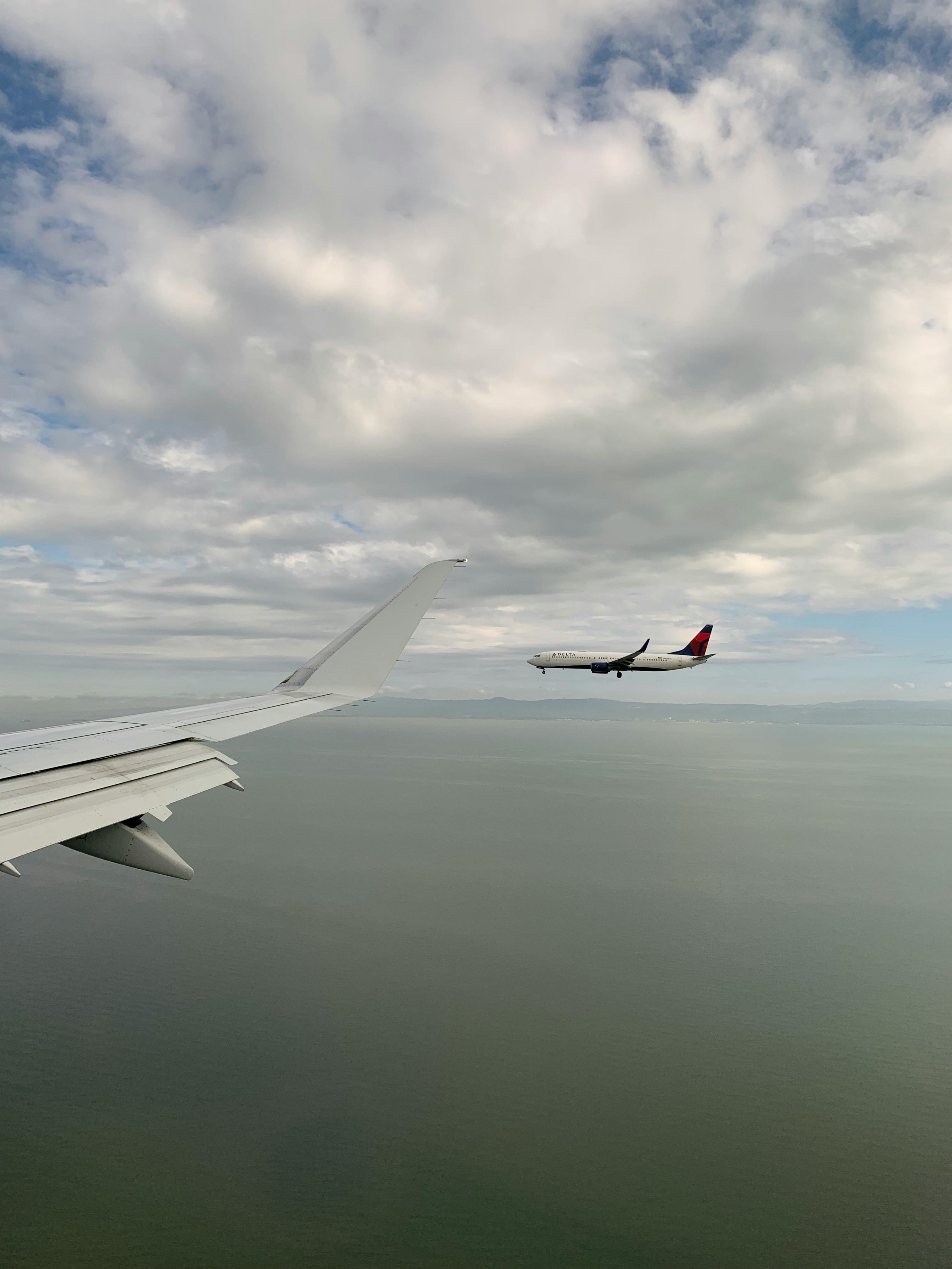 Photo of Airplane Across the Clouds during Night Time · Free Stock Photo Photo of Airplane Across the Clouds during Night Time · Free Stock Photo