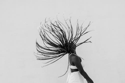 Woman In White Dress Flipping Hair