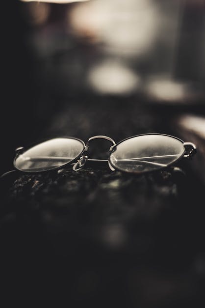 Grayscale Photography Of Folded Eyeglasses · Free Stock Photo