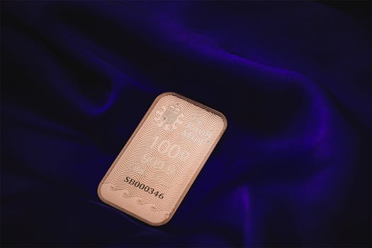 Elegant gold bar resting on deep purple velvet, symbolizing wealth and luxury.