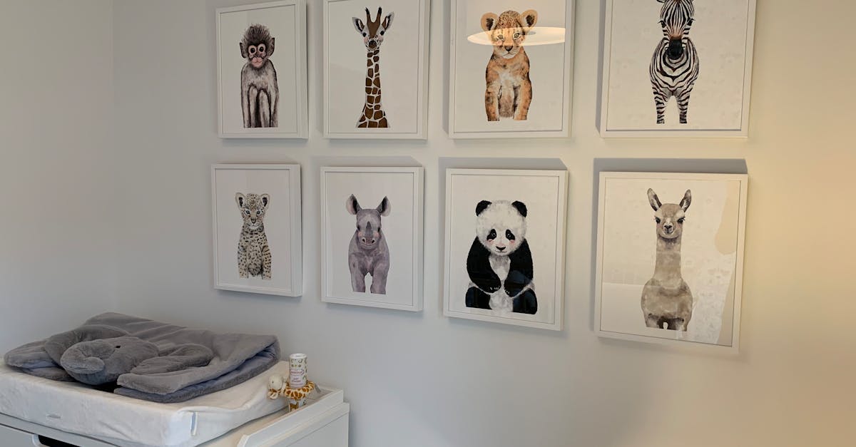 Adorable animal prints adding charm to a minimalist nursery wall decor.