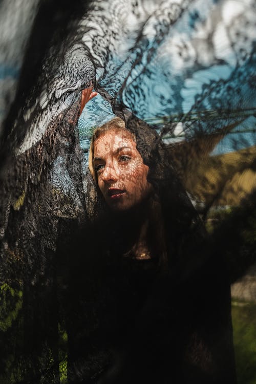 Free A woman is looking through a veil Stock Photo