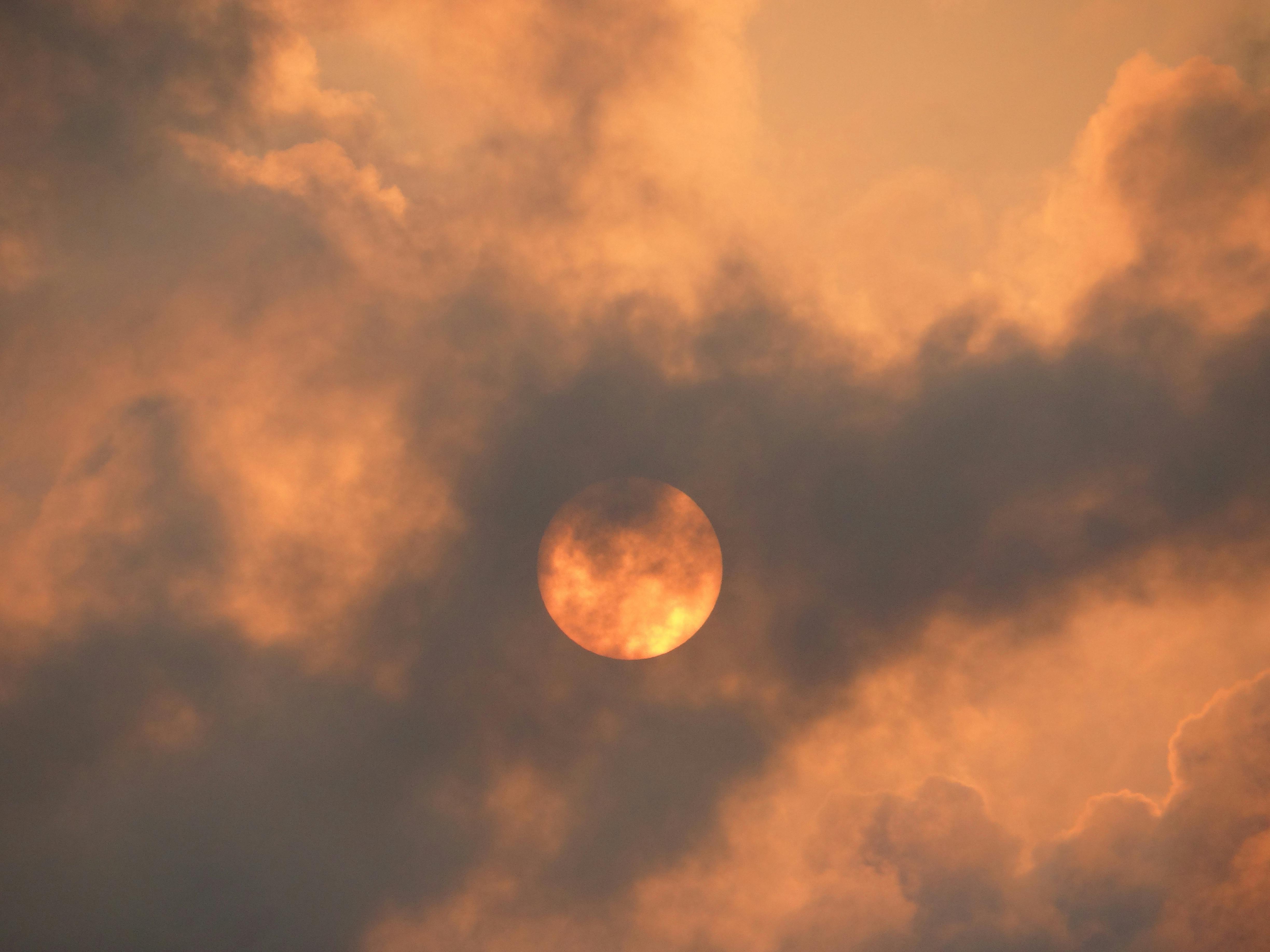 Yellow Sun behind Clouds · Free Stock Photo
