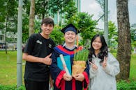 Happy Student with Friends After Graduation