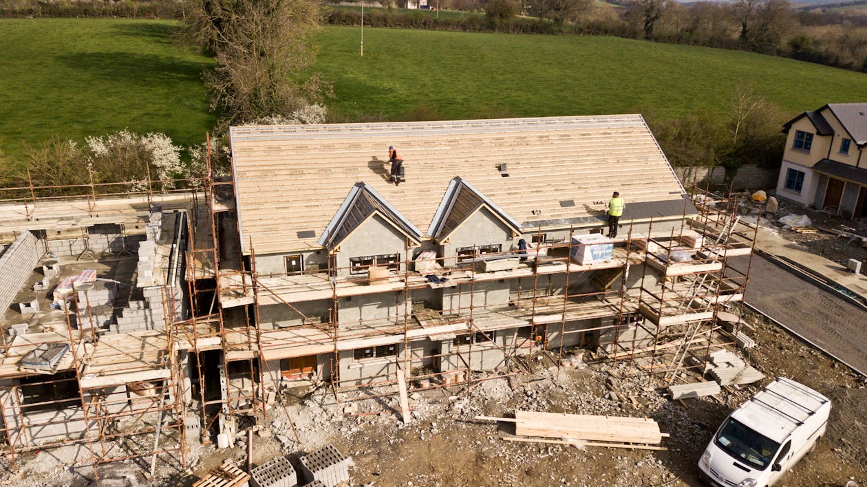 Free Aerial Photo Of Brown 3-story House Stock Photo