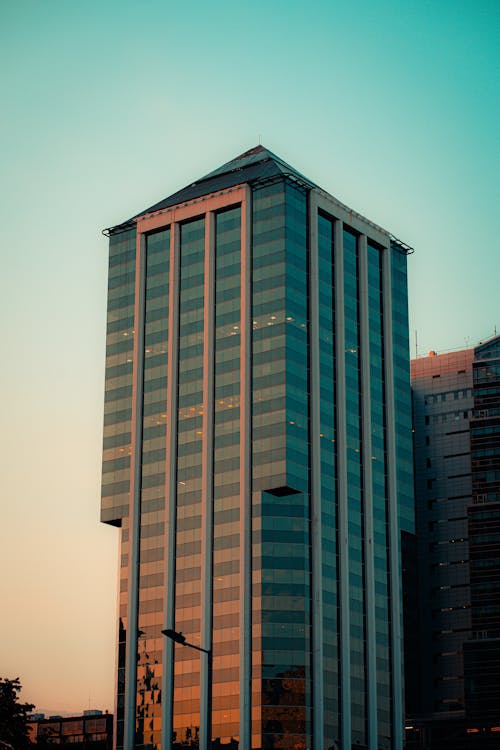 A tall building with a large window and a clock