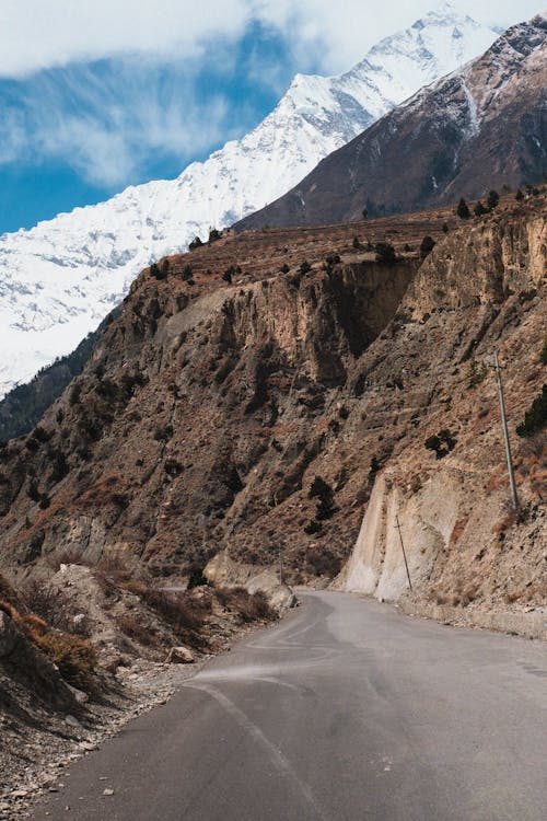 A road with mountains in the background