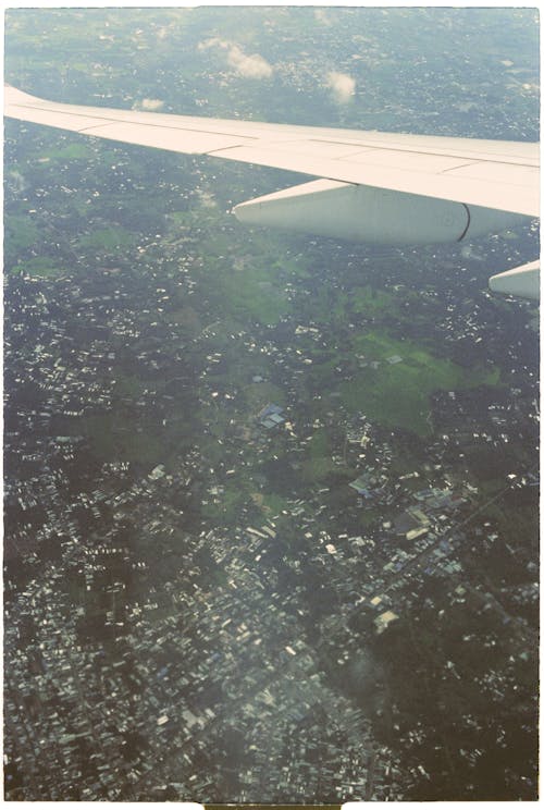 A view of a city from an airplane wing